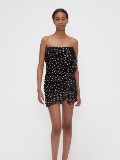 Model wearing POLKA DOTS BUSTIER MINI DRESS by Nina Ricci